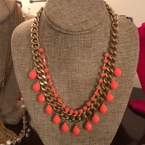 Gold tone necklace with peach beading